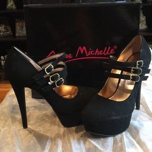 Black Anne Michelle suede pumps with straps